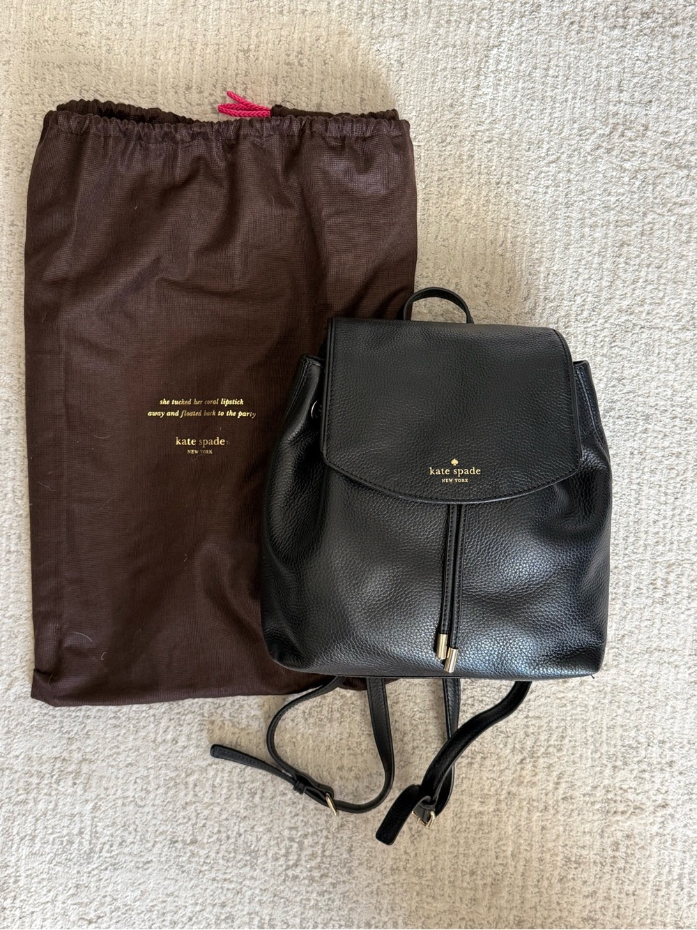 kate spade Black Pebbled Leather Drawstring Backpack with Gold-Tone Accents